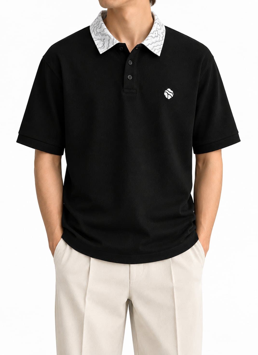 Black Land Form polo on model, chest and collar