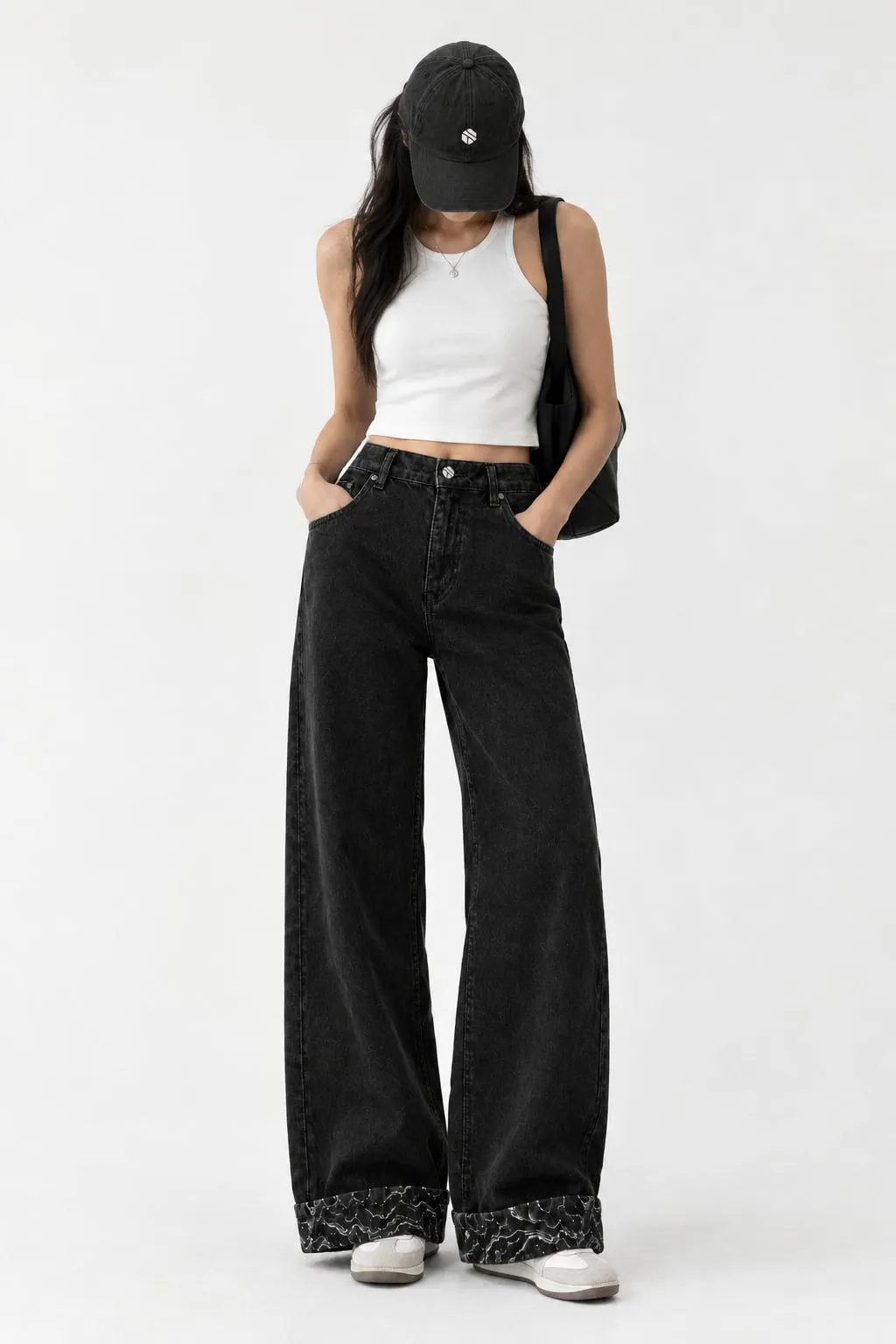 Model wearing Blackstone Denim with the cuffs rolled to show the stone pattern