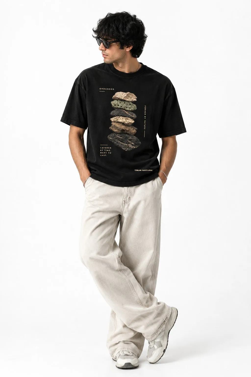 Model wearing Layers of Earth TN01 with off-white wide trousers